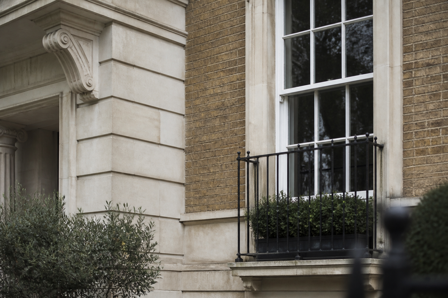 Traditional British residential stonework, brickwork and a sash window